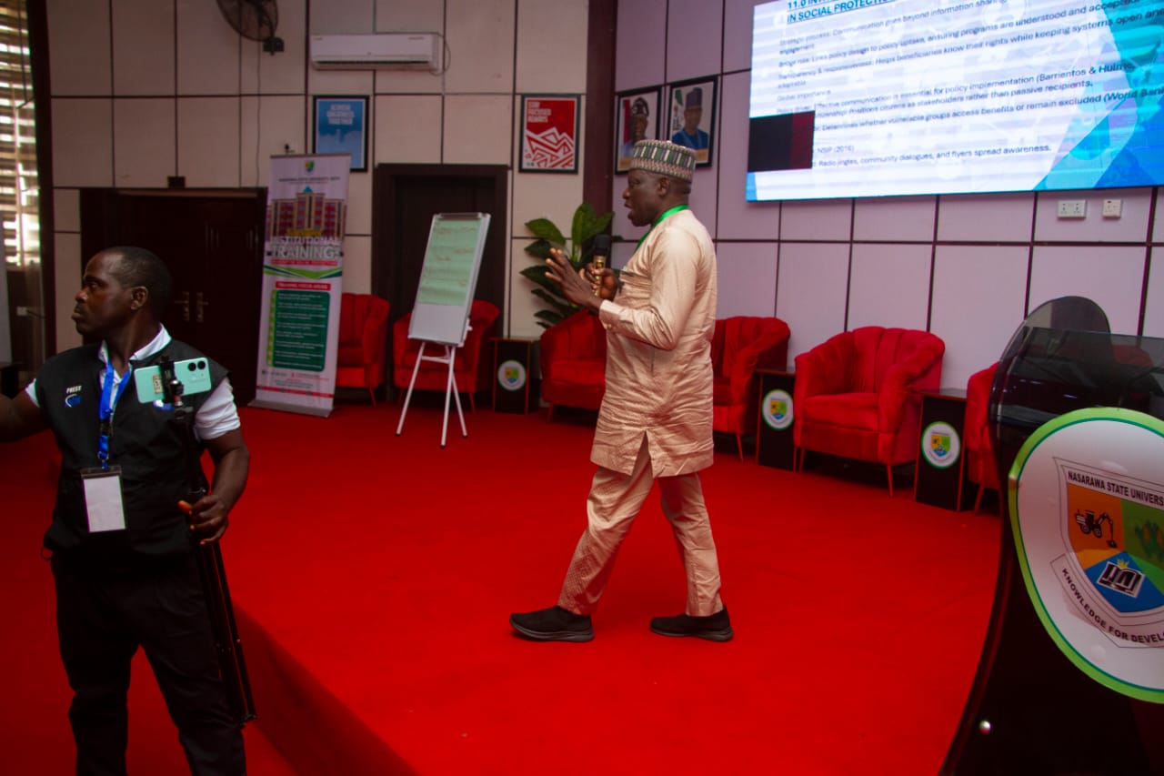 A presenter addressing participants during a university learning session