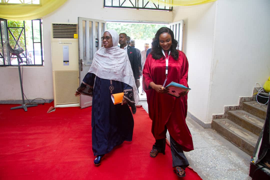 Participants walking into a university programme venue
